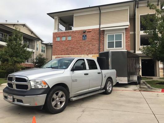 Over The Top Mover - moving truck in front of a house