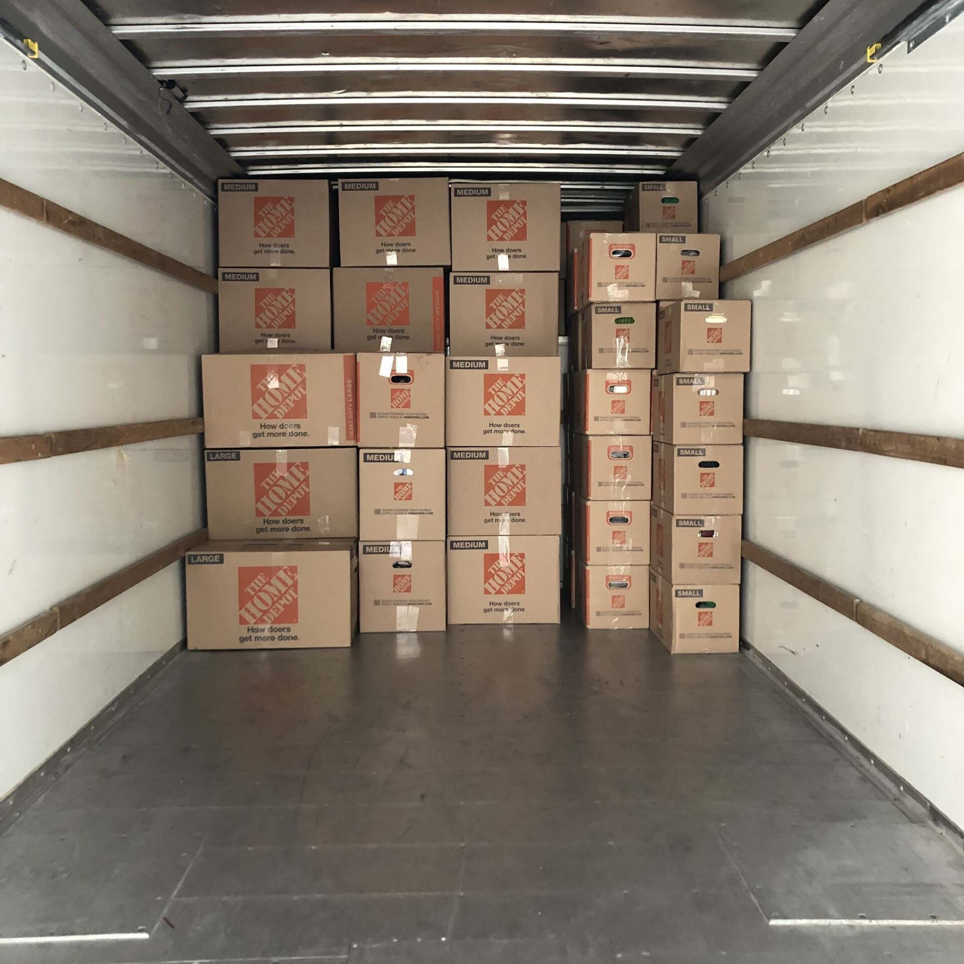 The inside of a home depot truck filled with boxes