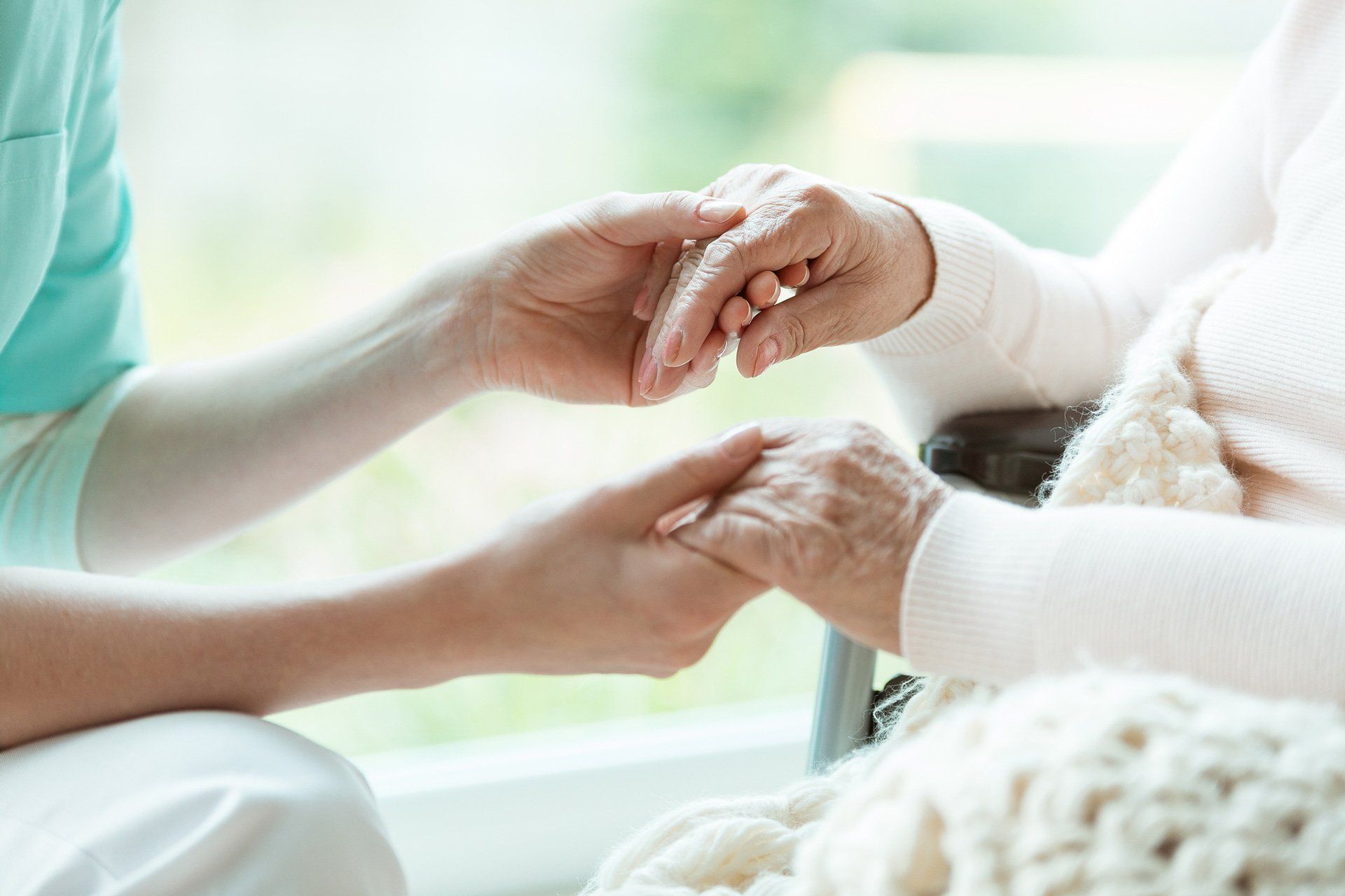 Home Assistance — Nurse Holding Elder's Hands in Marco Island, FL