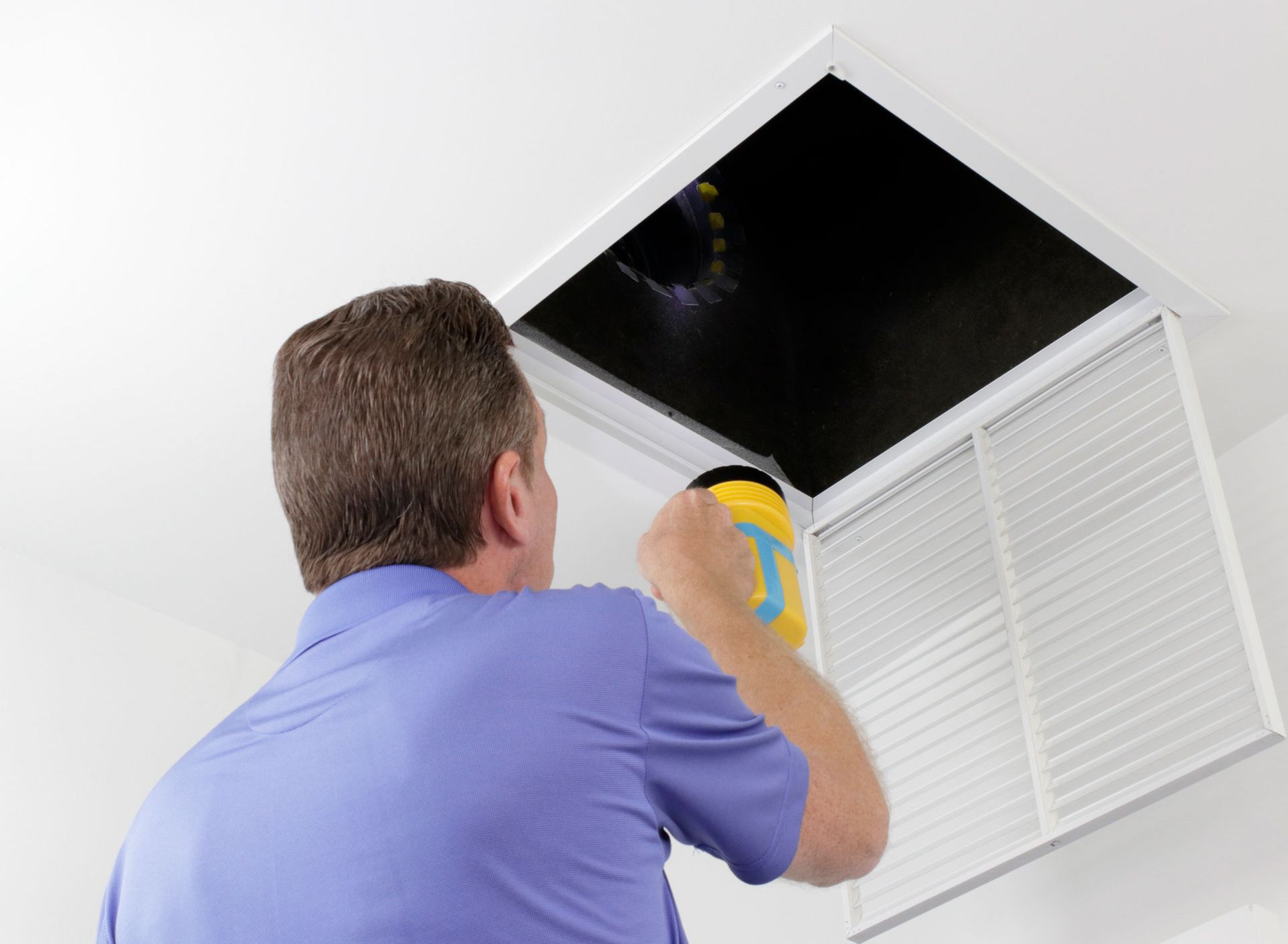 Man Inspecting Air Duct — Putnam Valley, NY — Precision Home Watch
