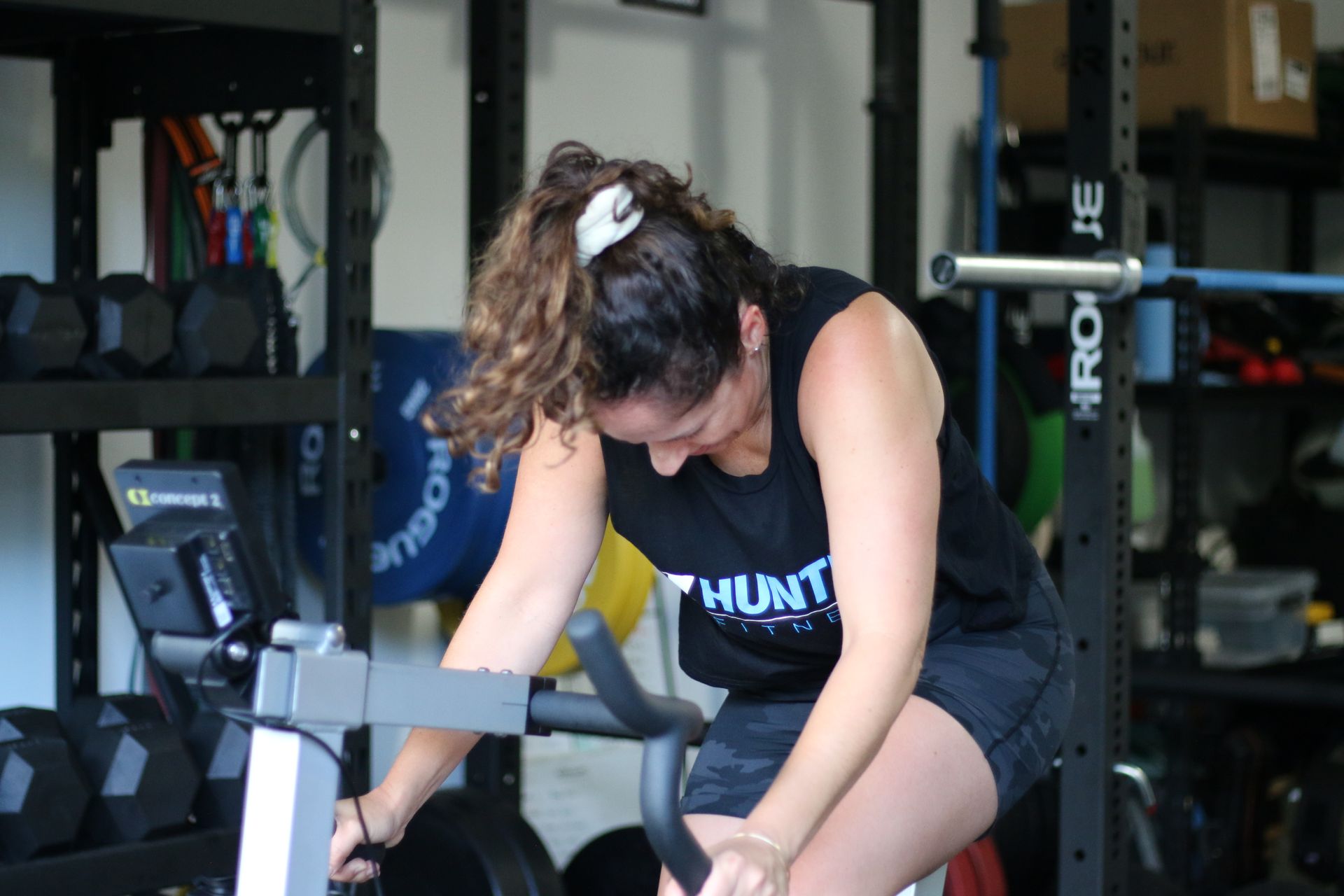 Woman on exercise bike — Functional, Strength And Conditioning Gym in Gold Coast, QLD