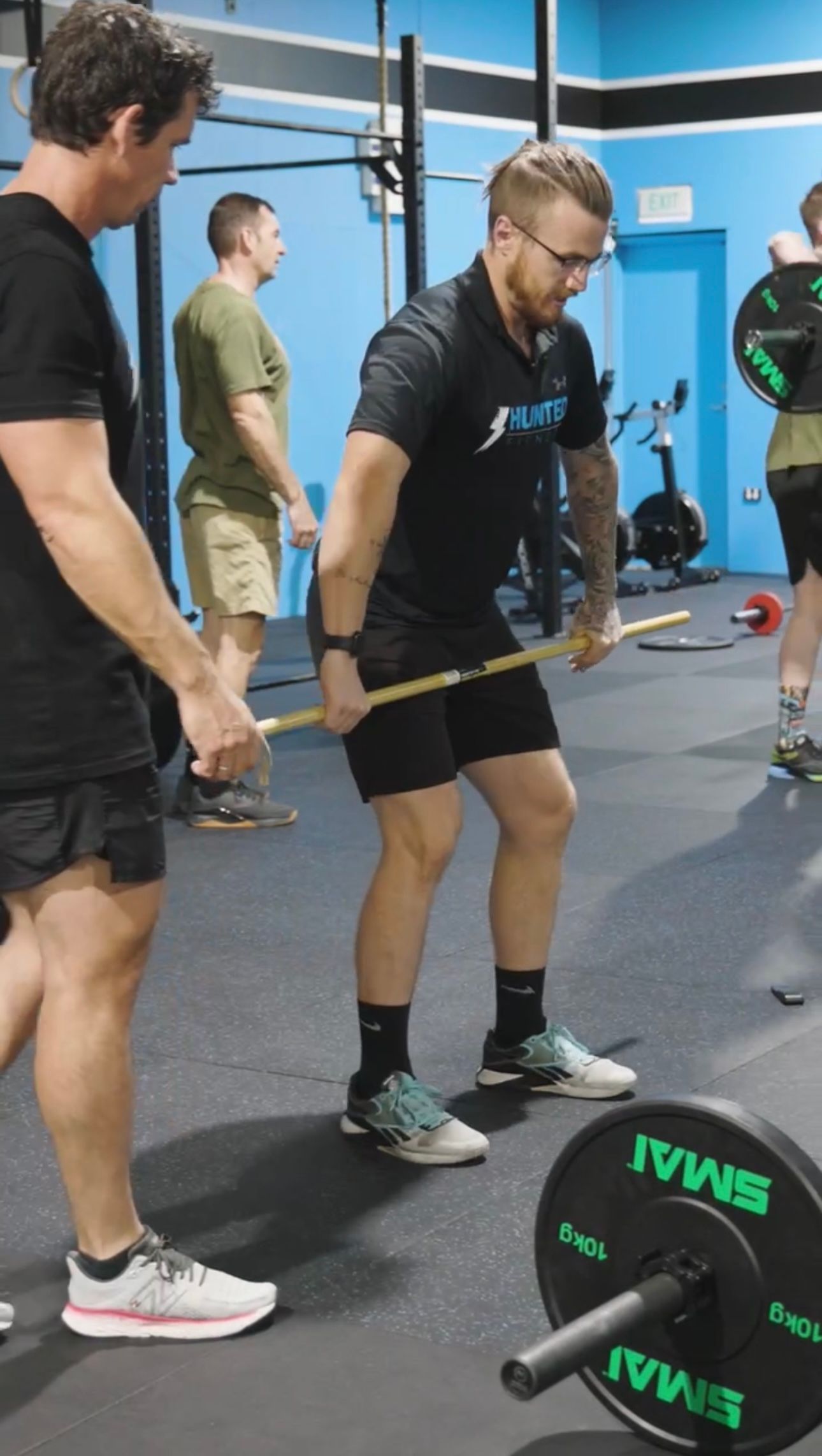 Close Up of  Coach Conducting assistance — Functional, Strength And Conditioning Gym in Gold Coast, QLD