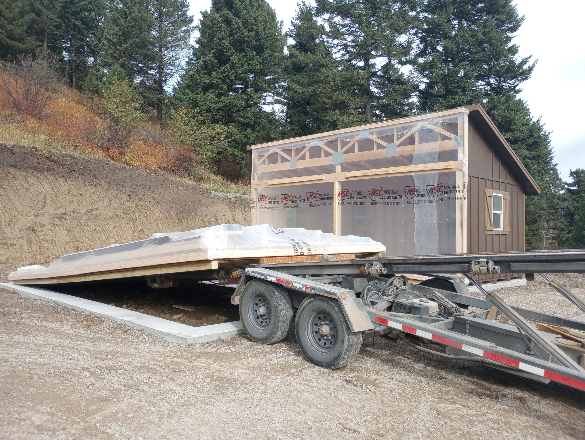 A trailer with a house on it is parked on the side of the road