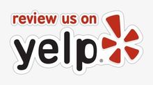 A yelp logo that says review us on yelp