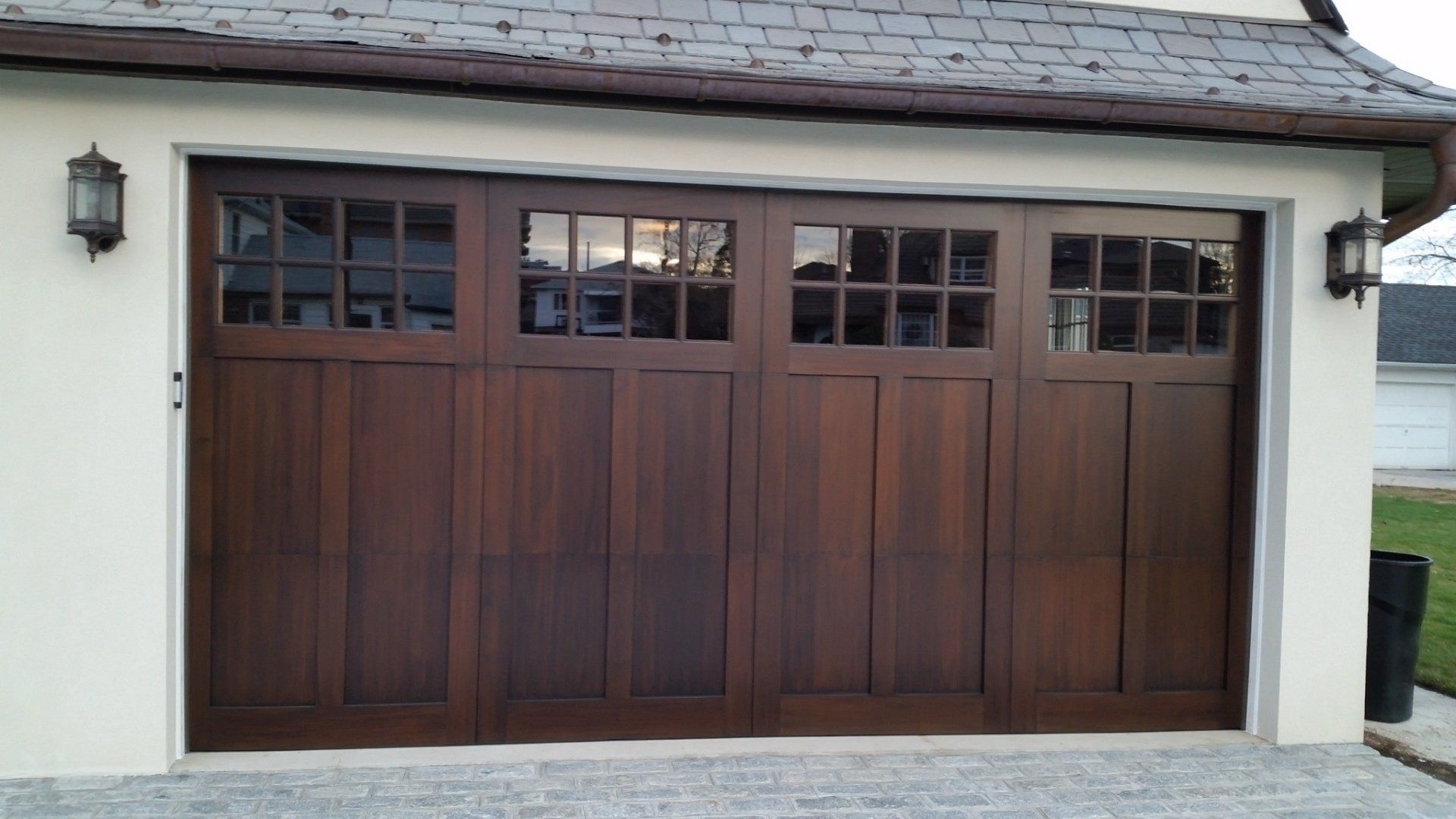 Residential carriage door made of wood