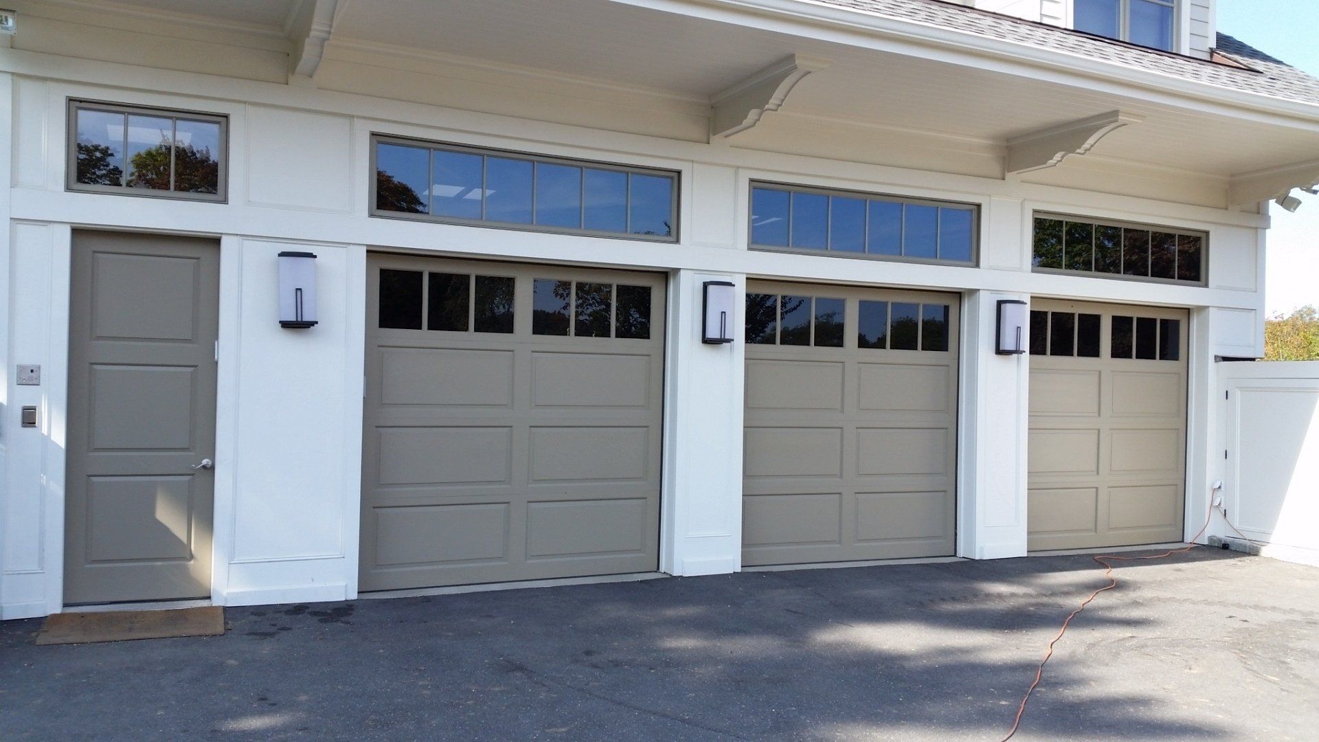 dual garage door installation in Old Westbury, NY - Regina Door & Design Corp
