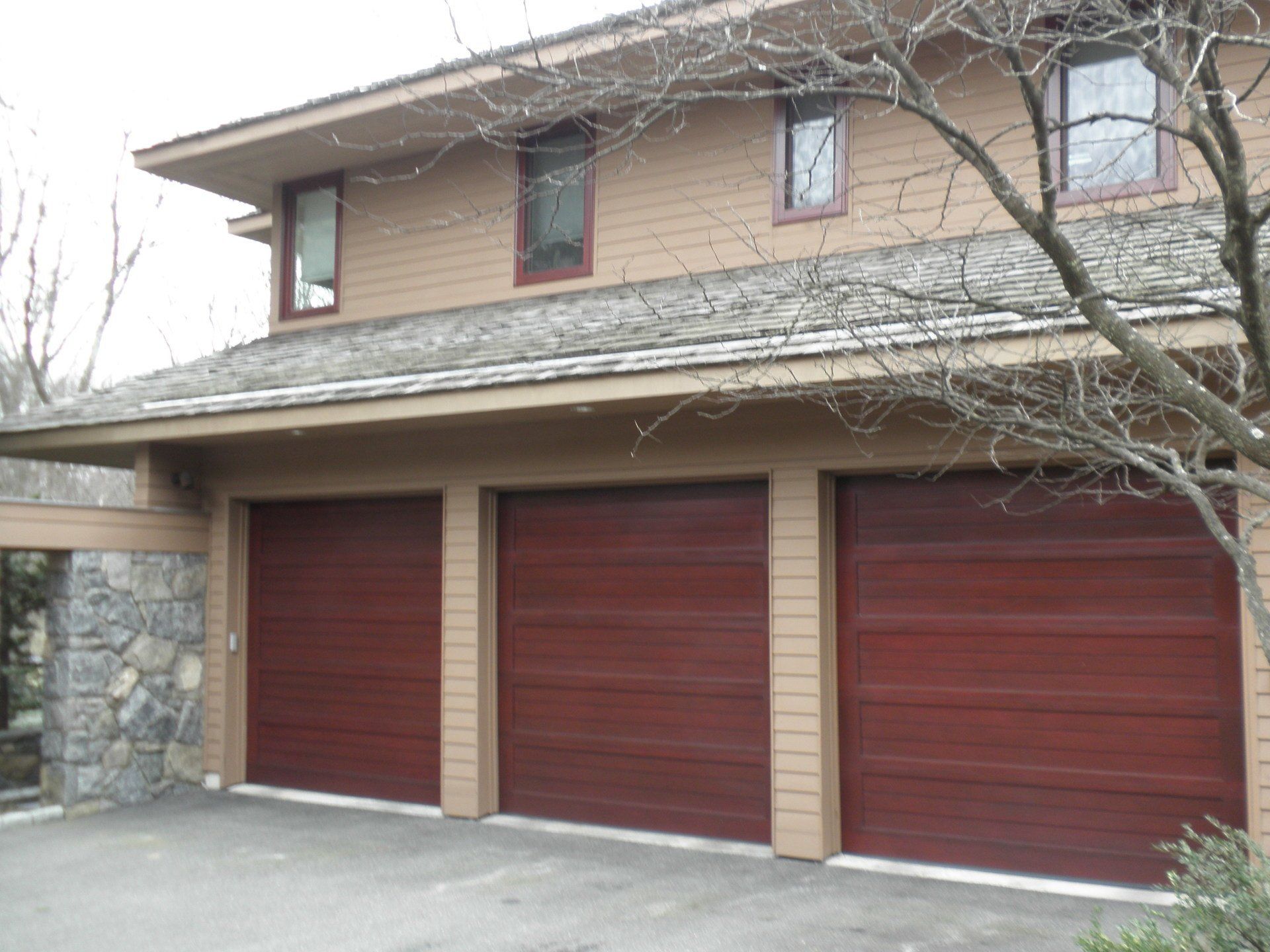 three door garage installed in Old Westbury, NY - Regina Door & Design Corp