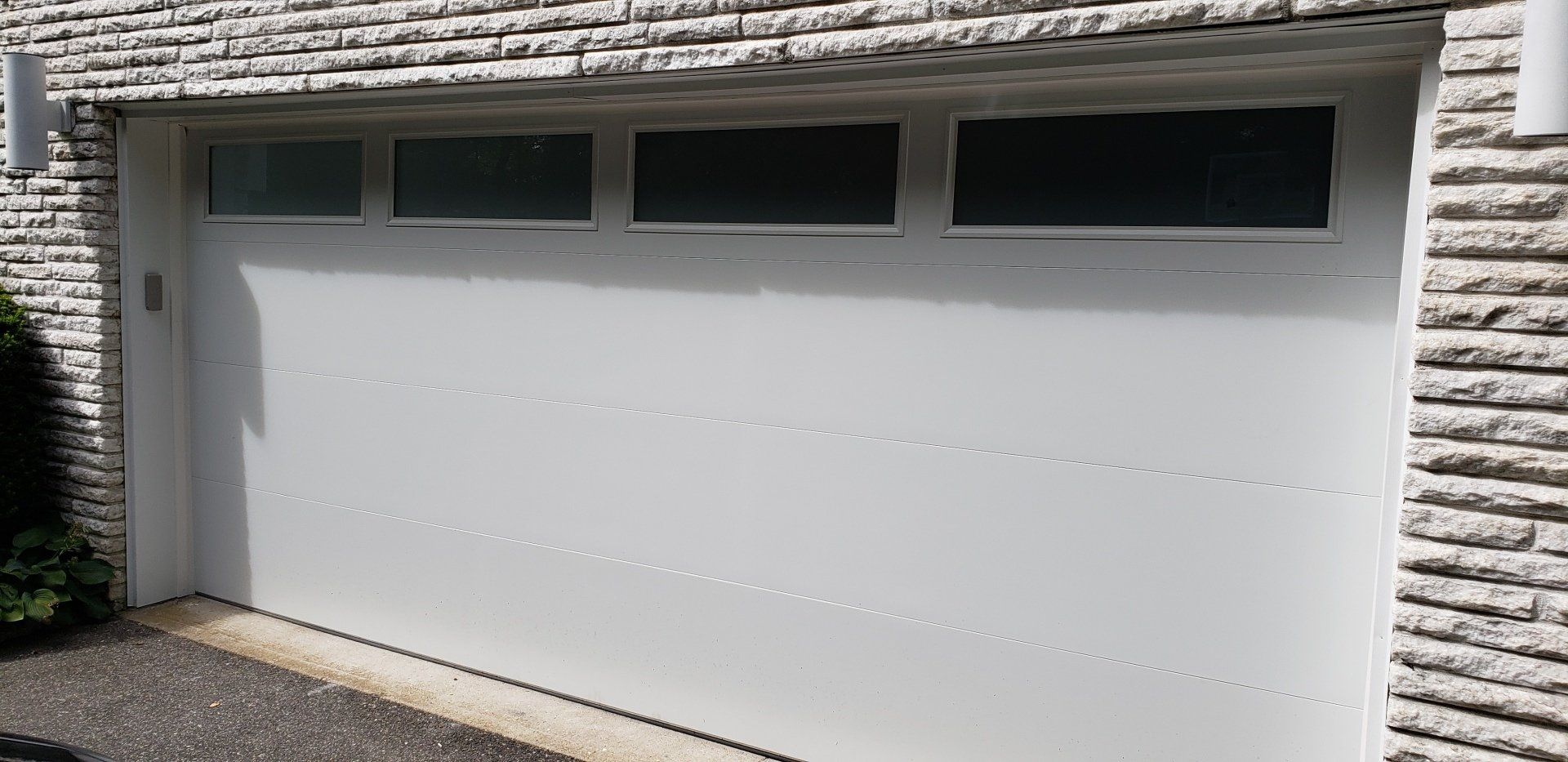 extra wide garage door installation in Old Wesbury, NY - Regina Door & Design Corp
