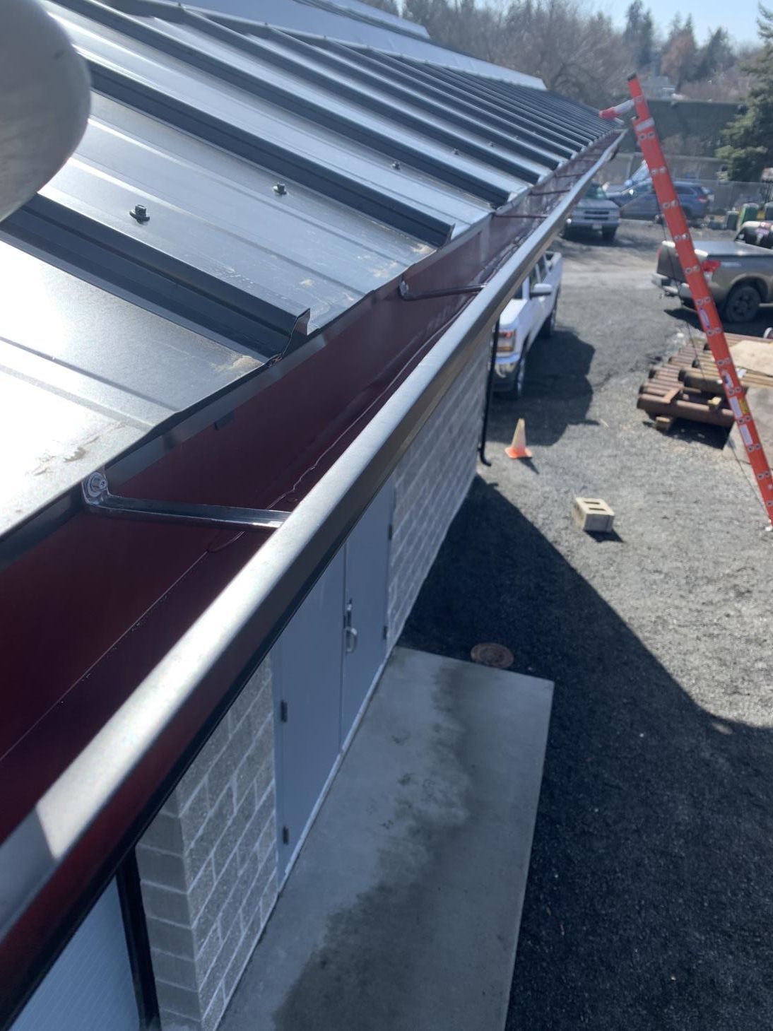 An image showcasing the installation process of a gutter guard system.