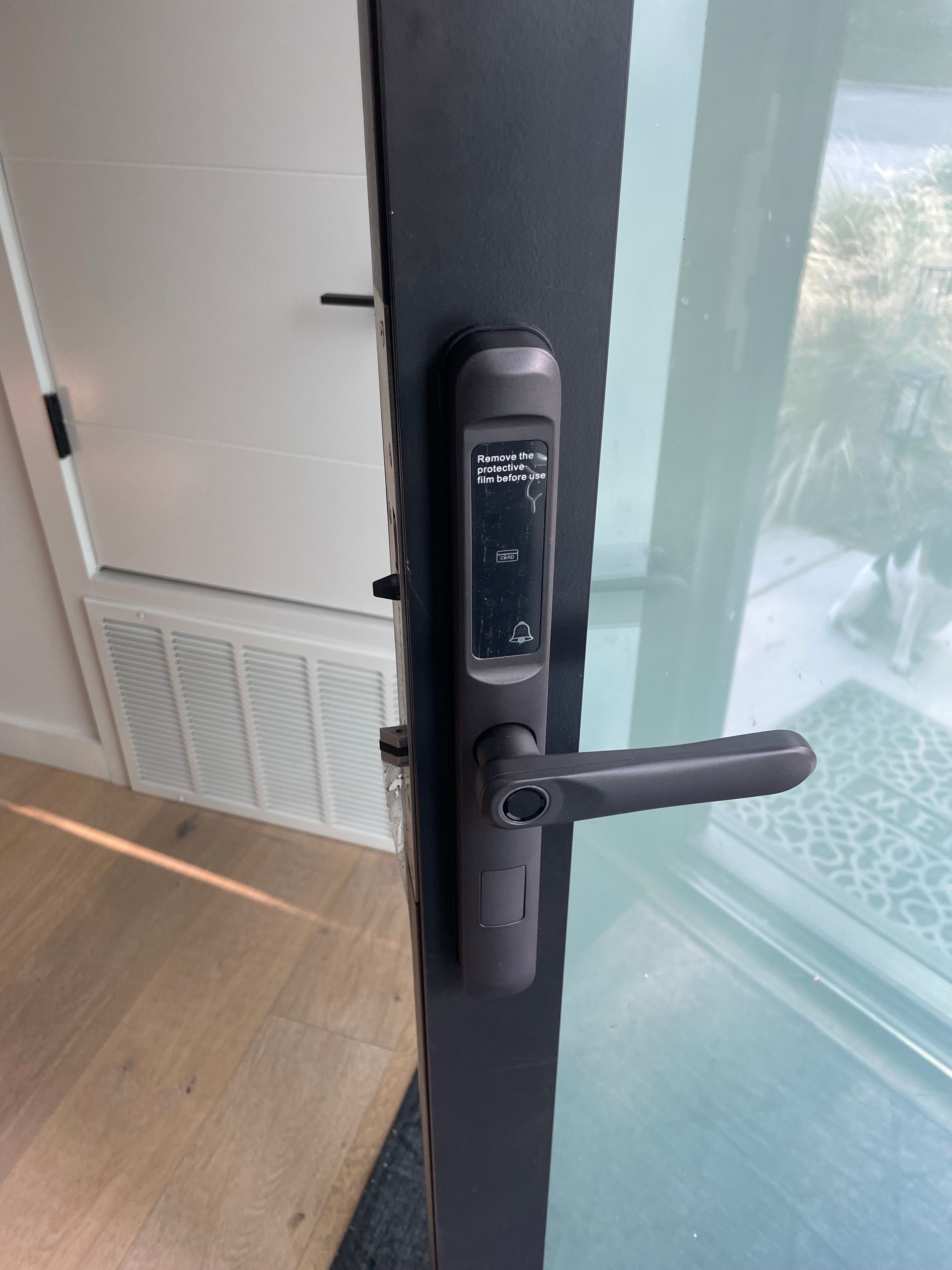 A close up of a door with a digital lock on it.