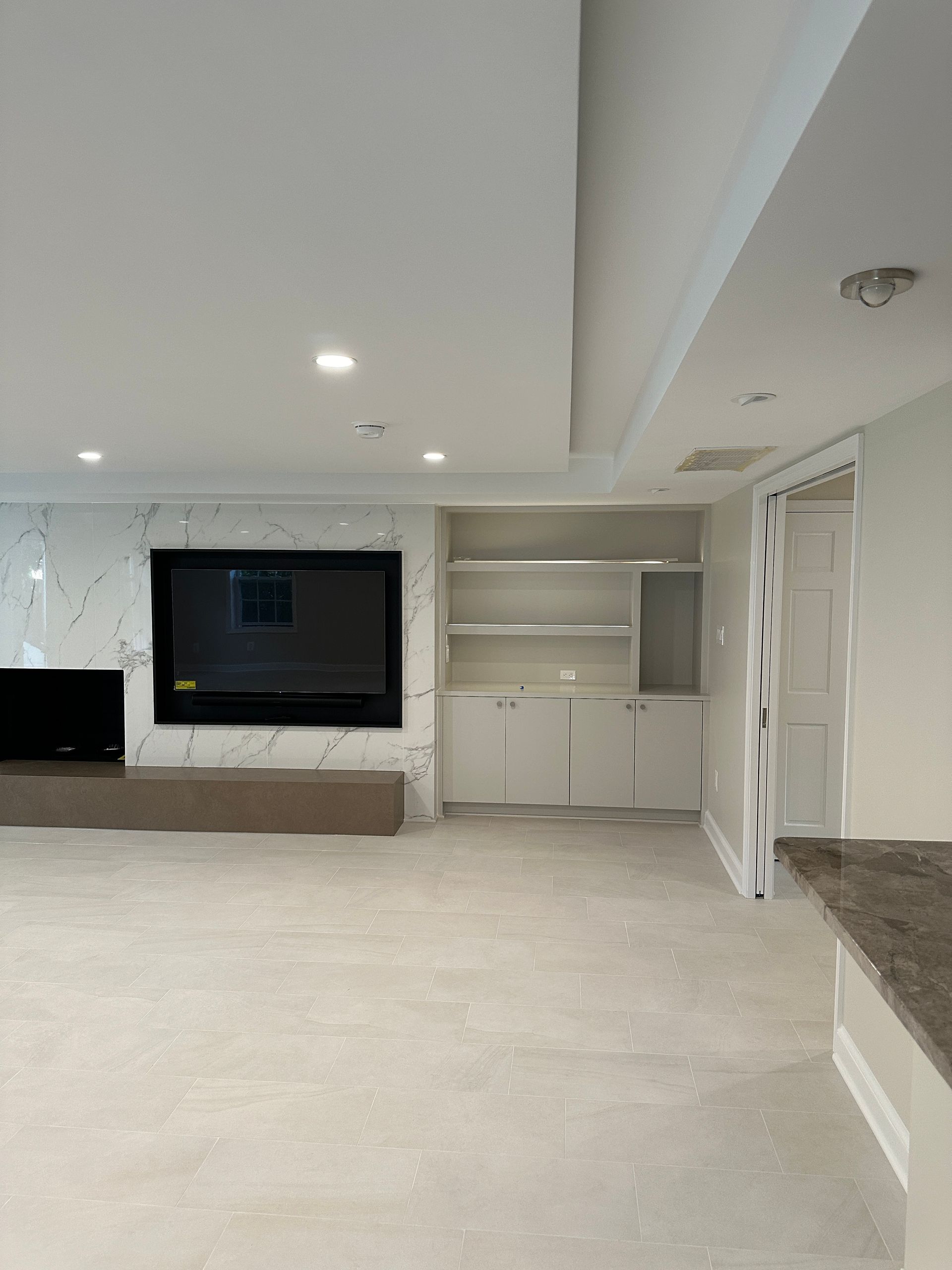 custom porcelain wall with a flat screen tv 