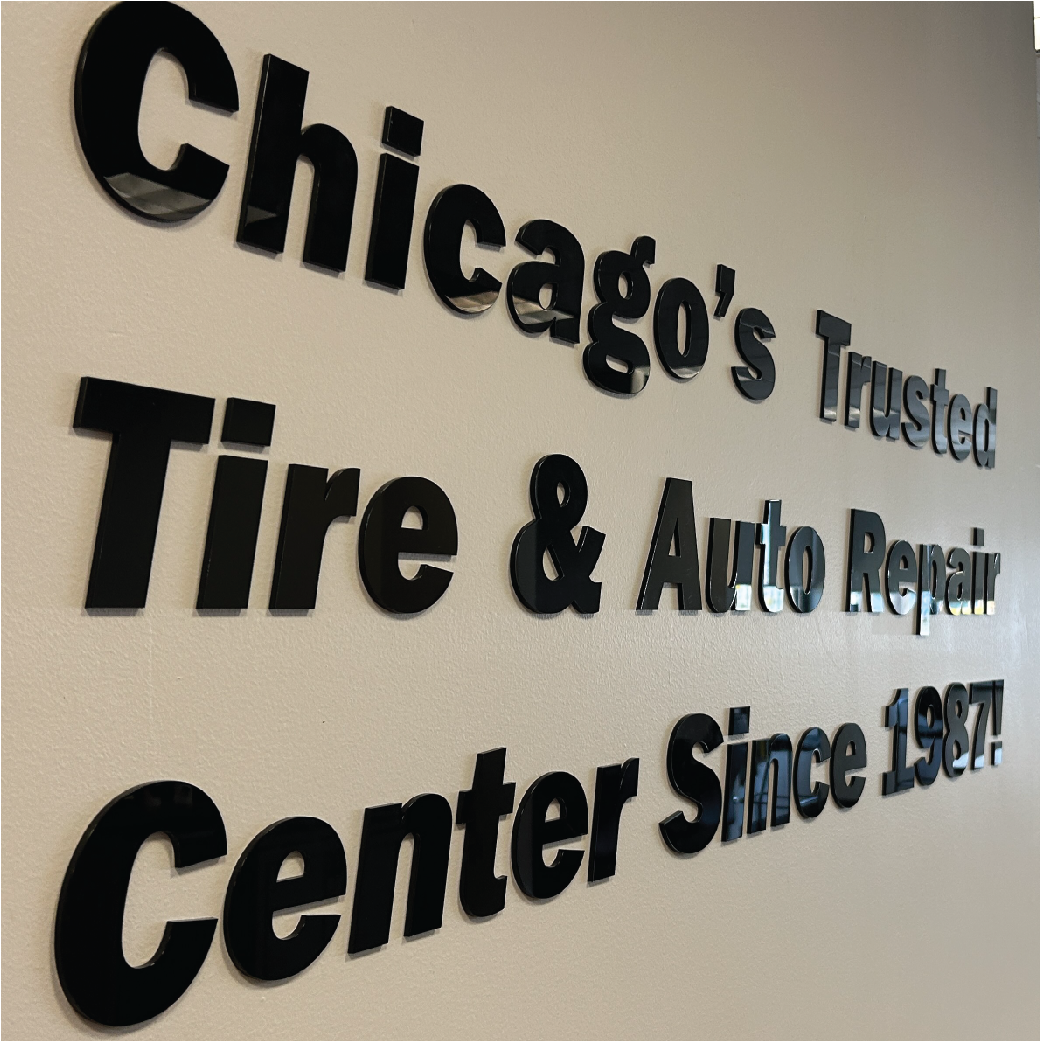 Black lettering on a white wall that reads 