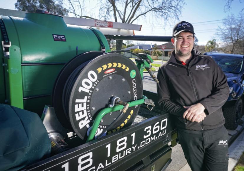 Technician standing next to work Ute — Professional Pest Control In Thurgoona NSW