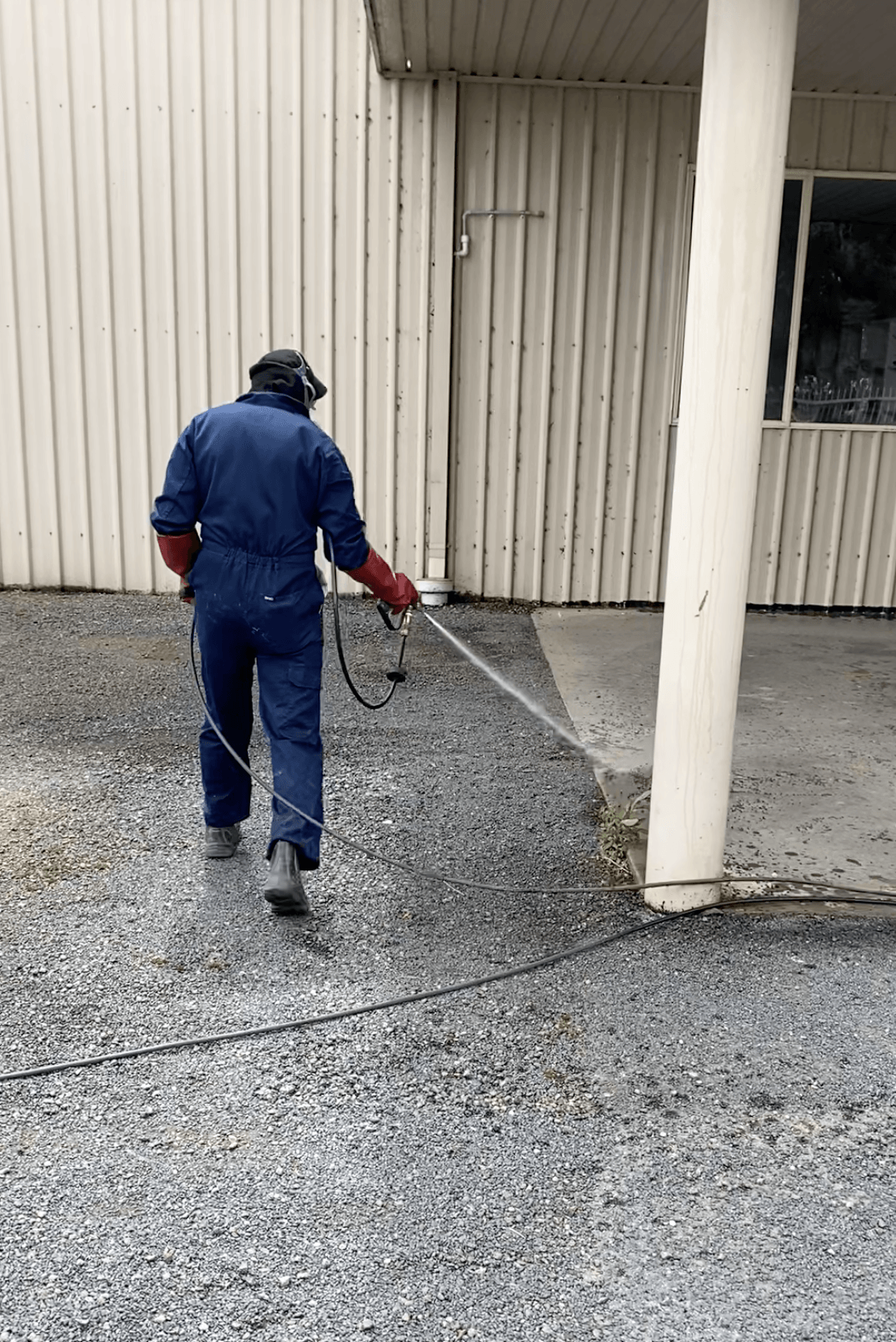Technician Wearing Full PPE while Spraying — Professional Pest Control In Thurgoona NSW