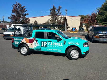 A jp carroll truck is parked in a parking lot
