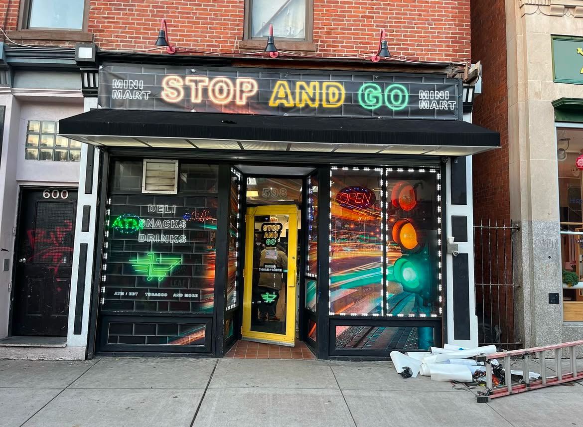 A store front that says stop and go on it