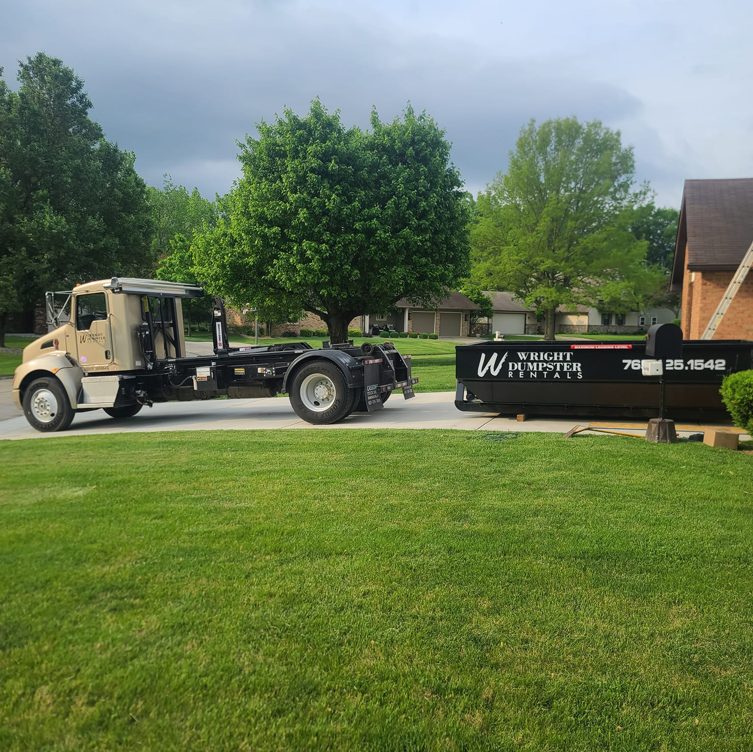 delivering a black 15 yard dumpster, dumpster rental services, fishers, madison county in, wright dumpster rentals