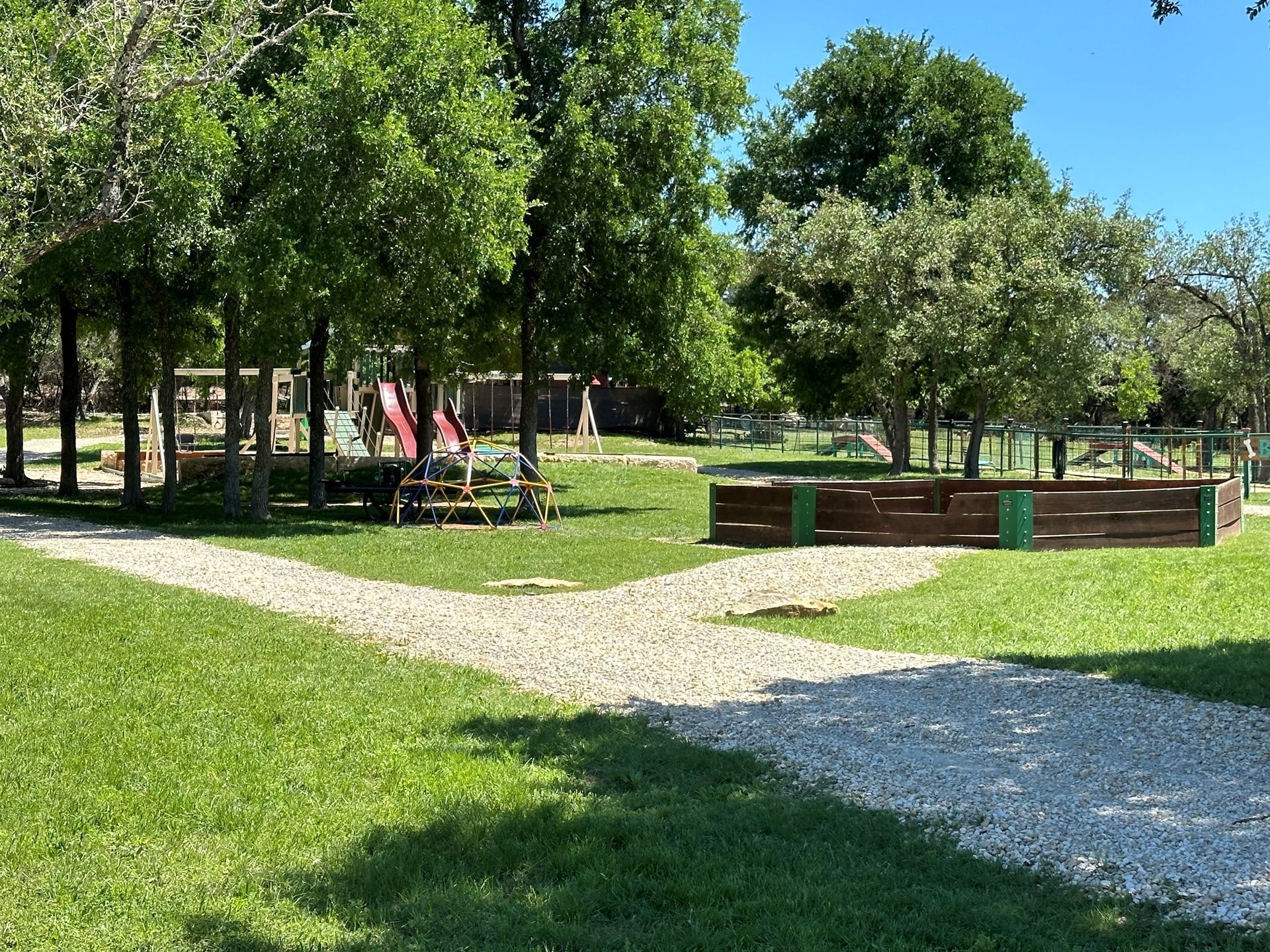 There is a picnic table in the middle of the park.