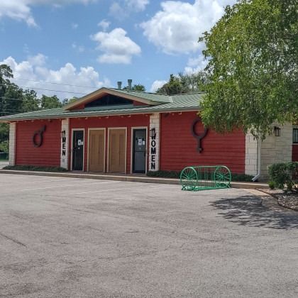 A red building with the word women on it