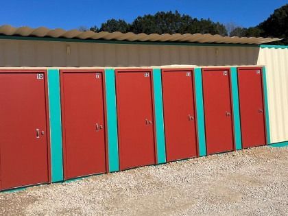 A row of red doors with numbers on them