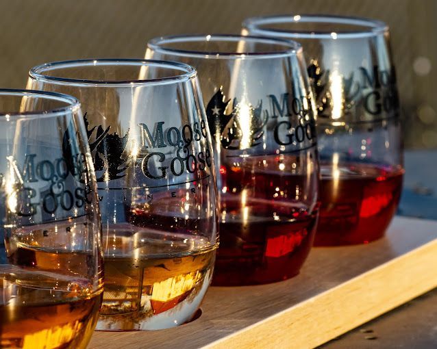 A row of glasses with the word goose on them