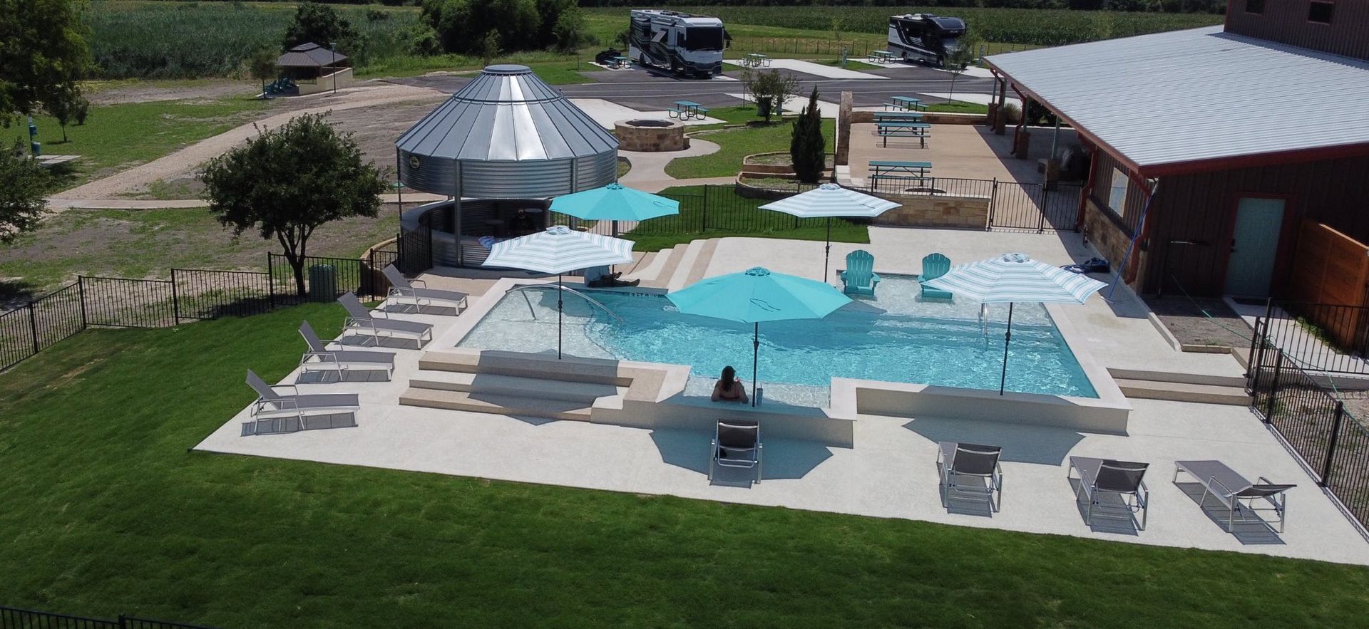 A bathroom with a texas flag shower curtain and a toilet.