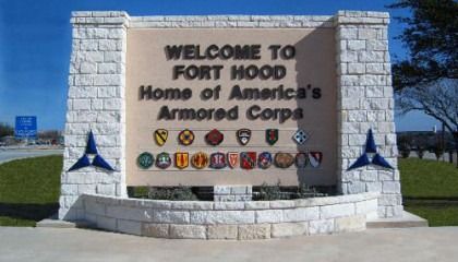 A sign that says welcome to fort hood home of america 's armored corps