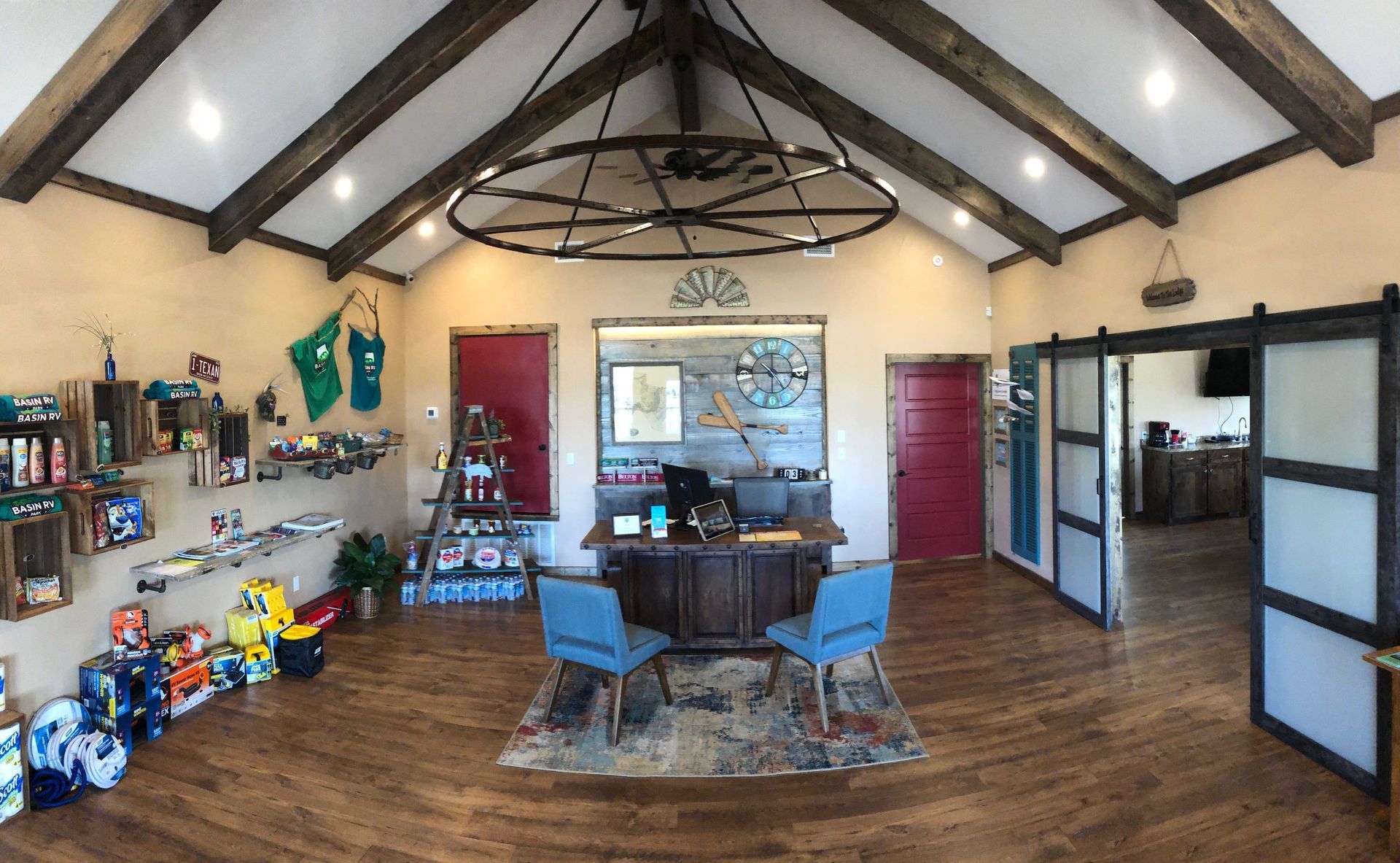 A large room with a desk and chairs in it