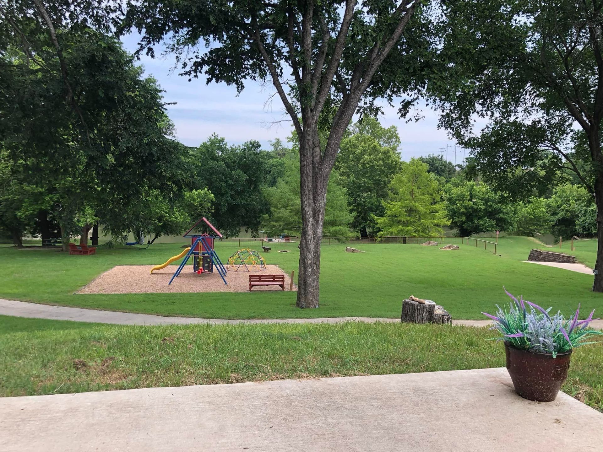 There is a playground in the middle of the park.