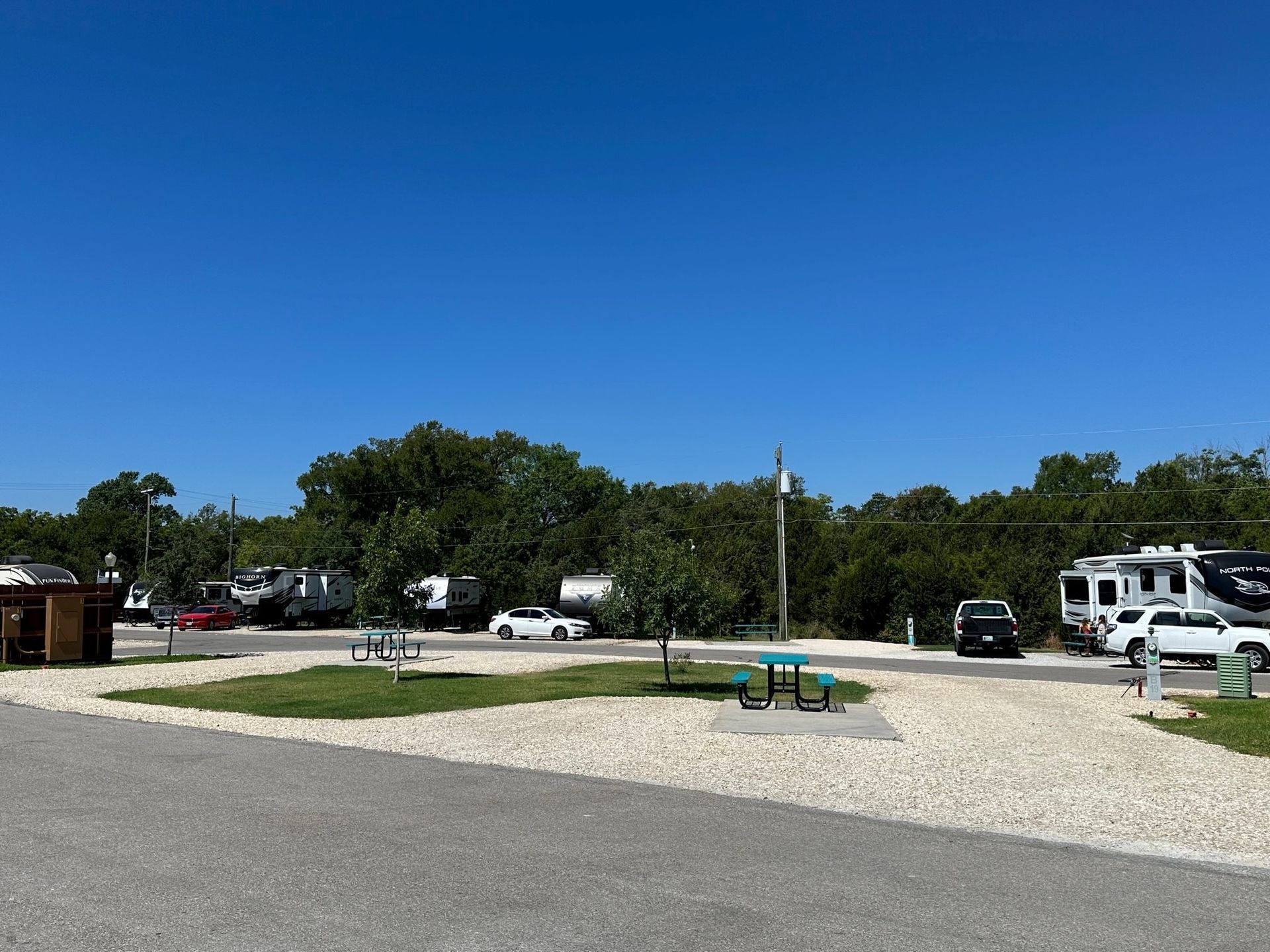 A campground with a lot of vehicles parked in it