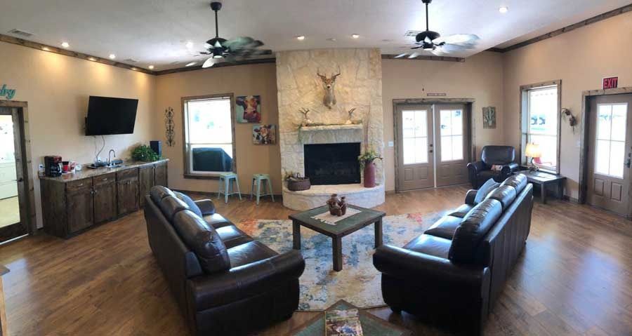 A living room filled with furniture and a fireplace.