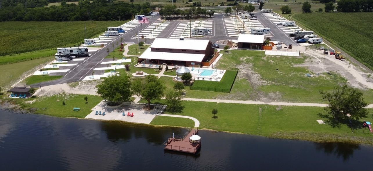 A food truck is parked in front of a sign that says `` texans feeding texans ''.