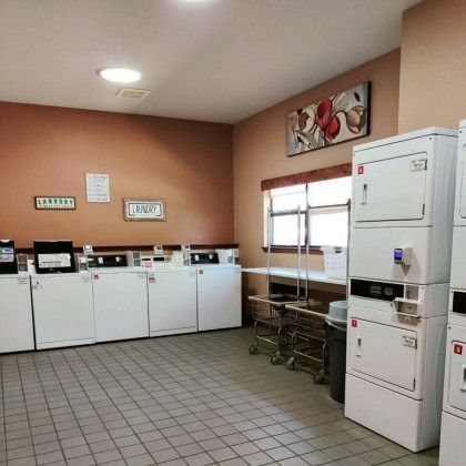 A laundromat with a lot of washers and dryers