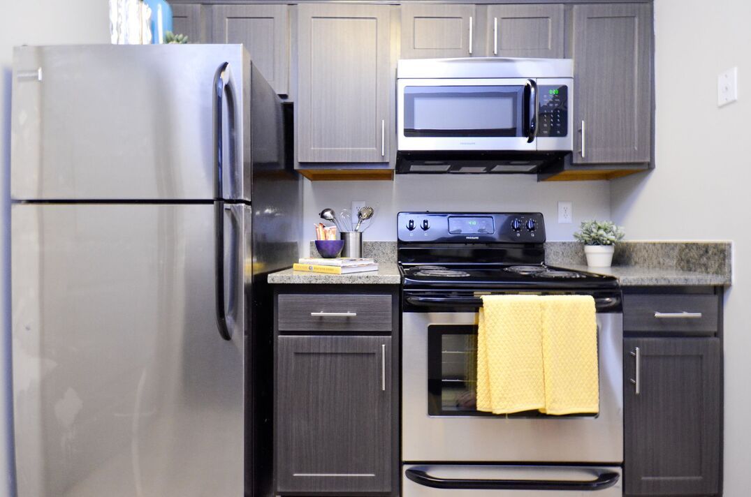 Kitchen with stainless steel appliances and updated cabinetry.
