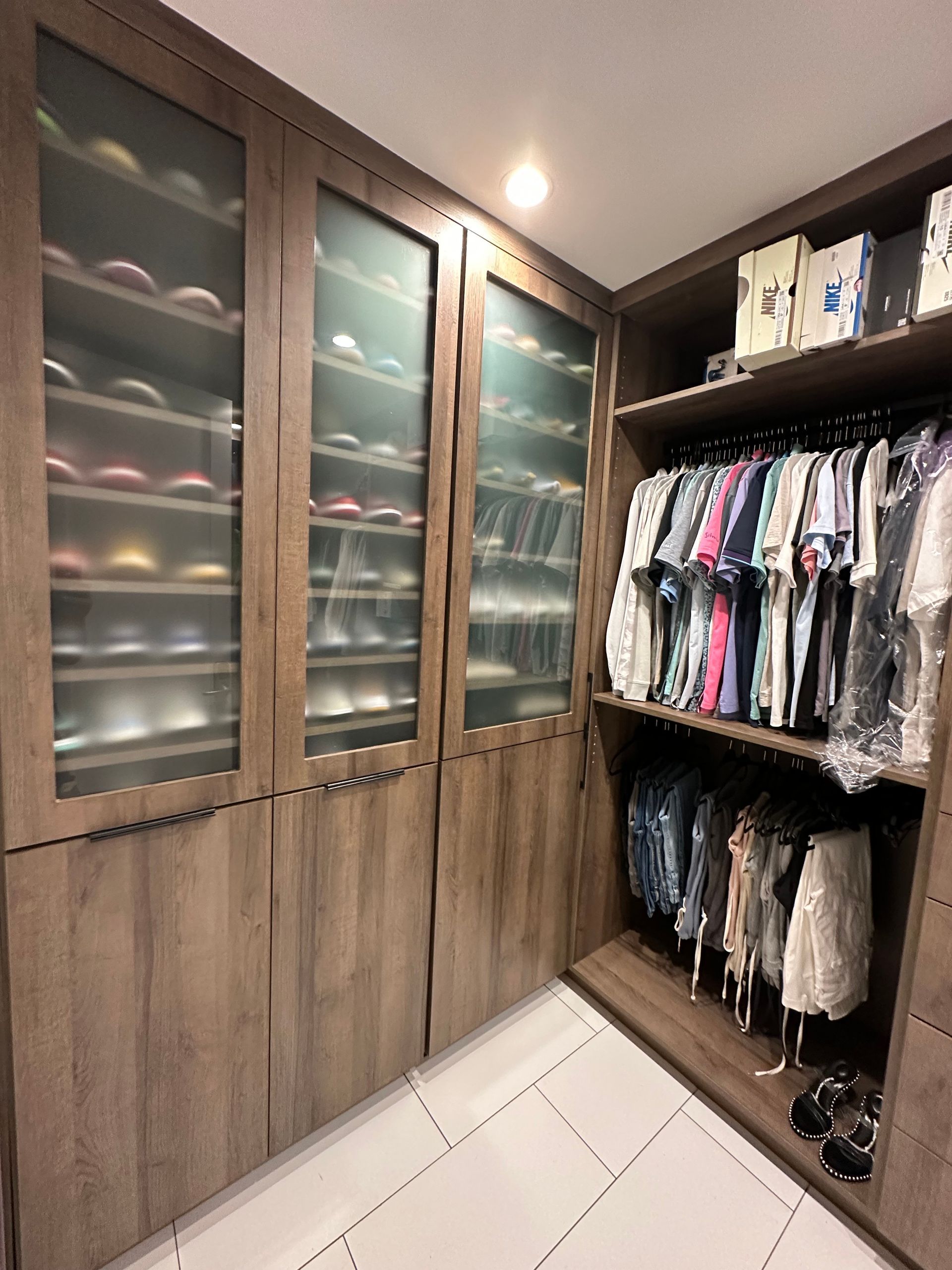 A walk in closet filled with clothes 
