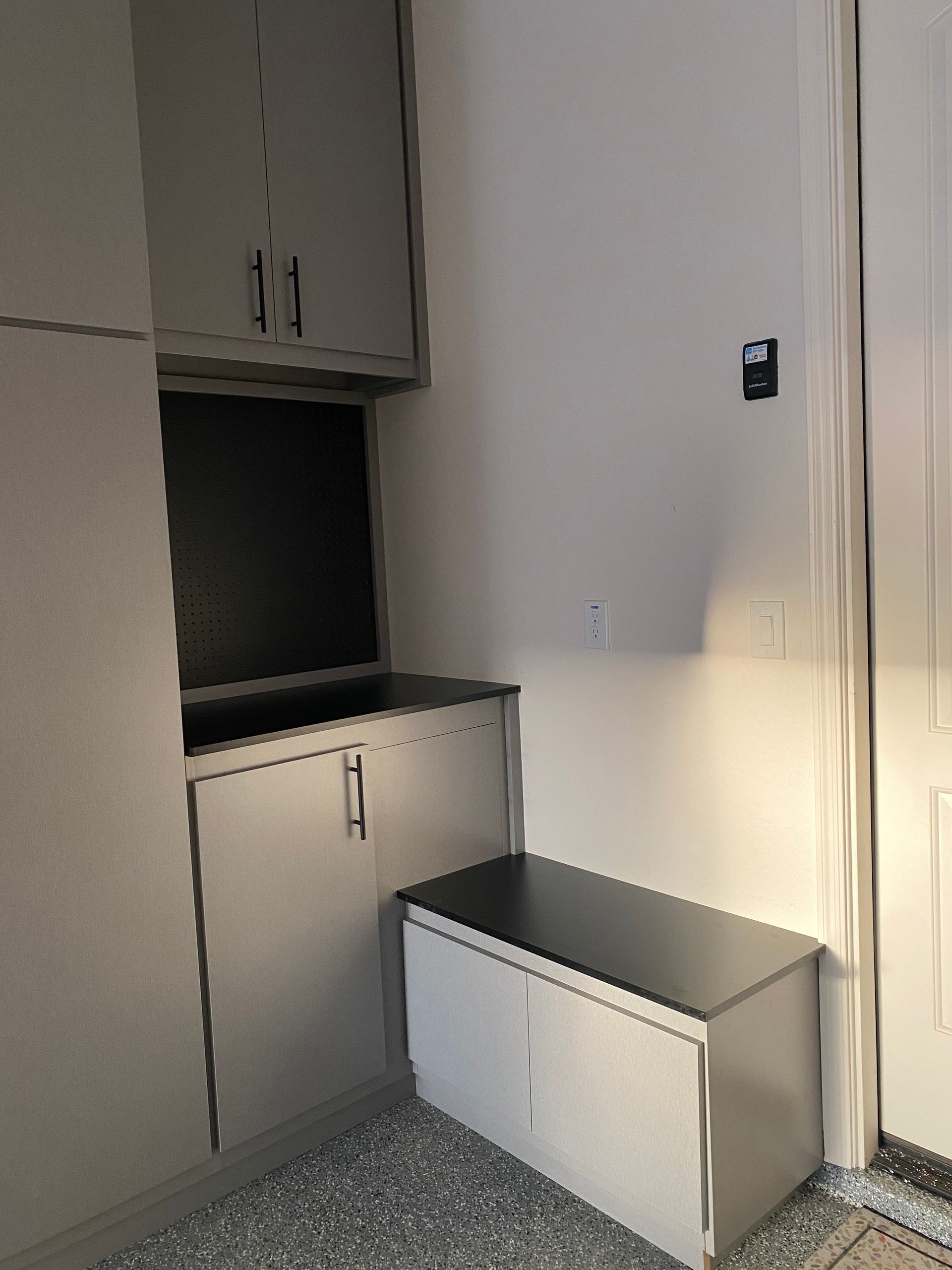 There is a bench in the corner of the room.