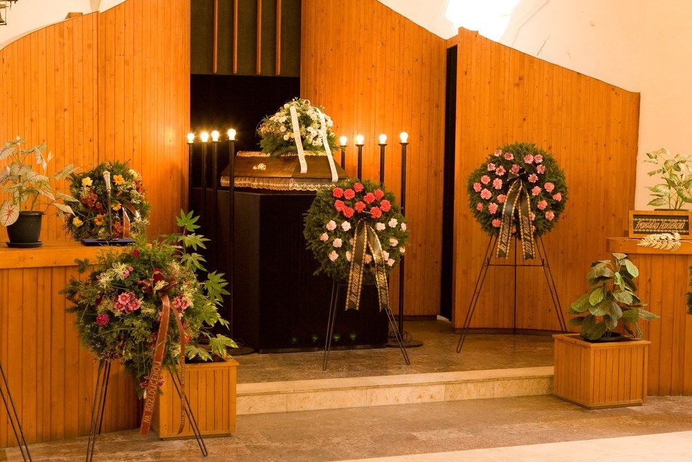 A Church With Flowers and Candles on the Altar — Becker Family Funerals In Taree, NSW