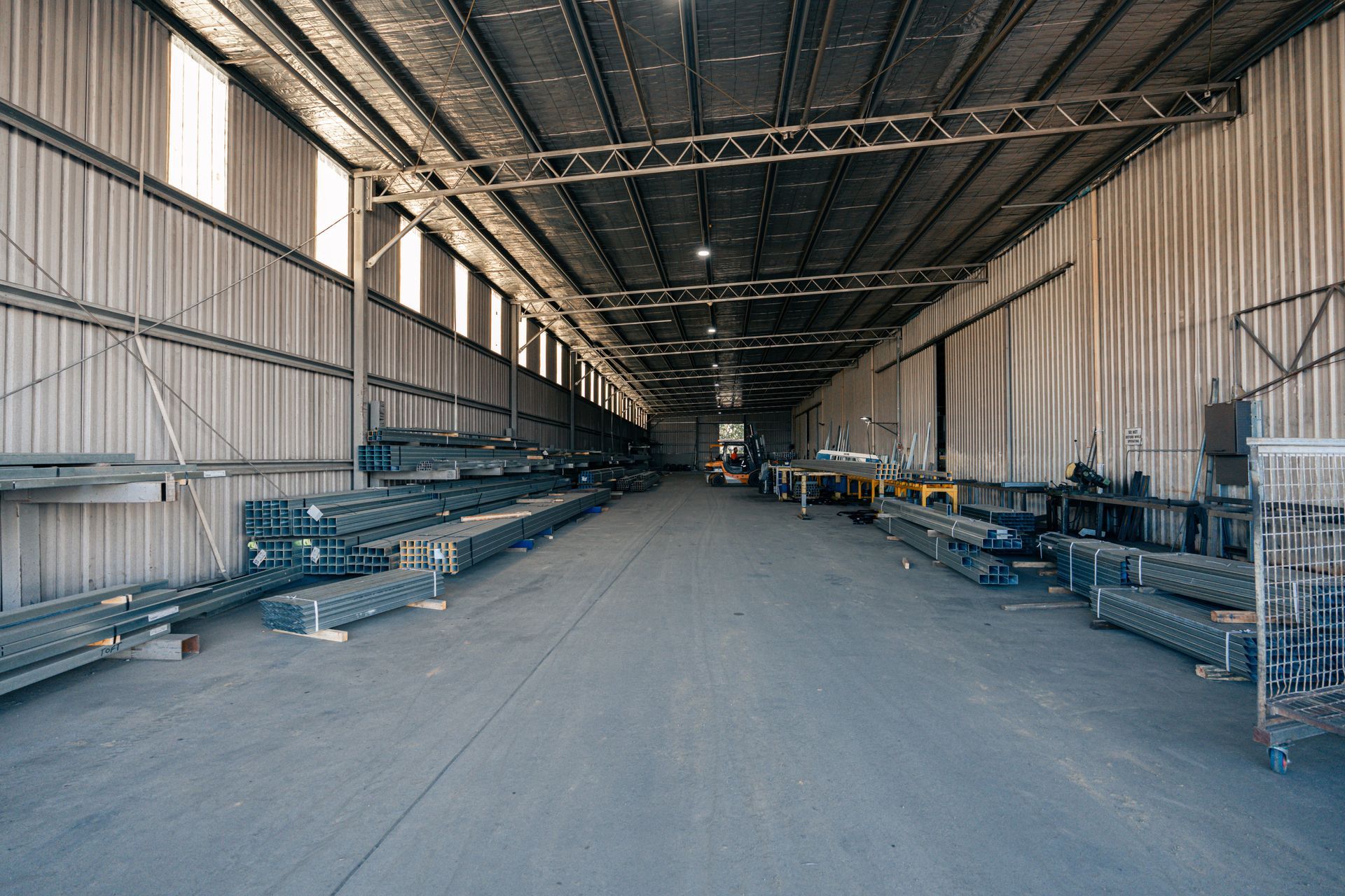A large warehouse filled with lots of metal pieces.