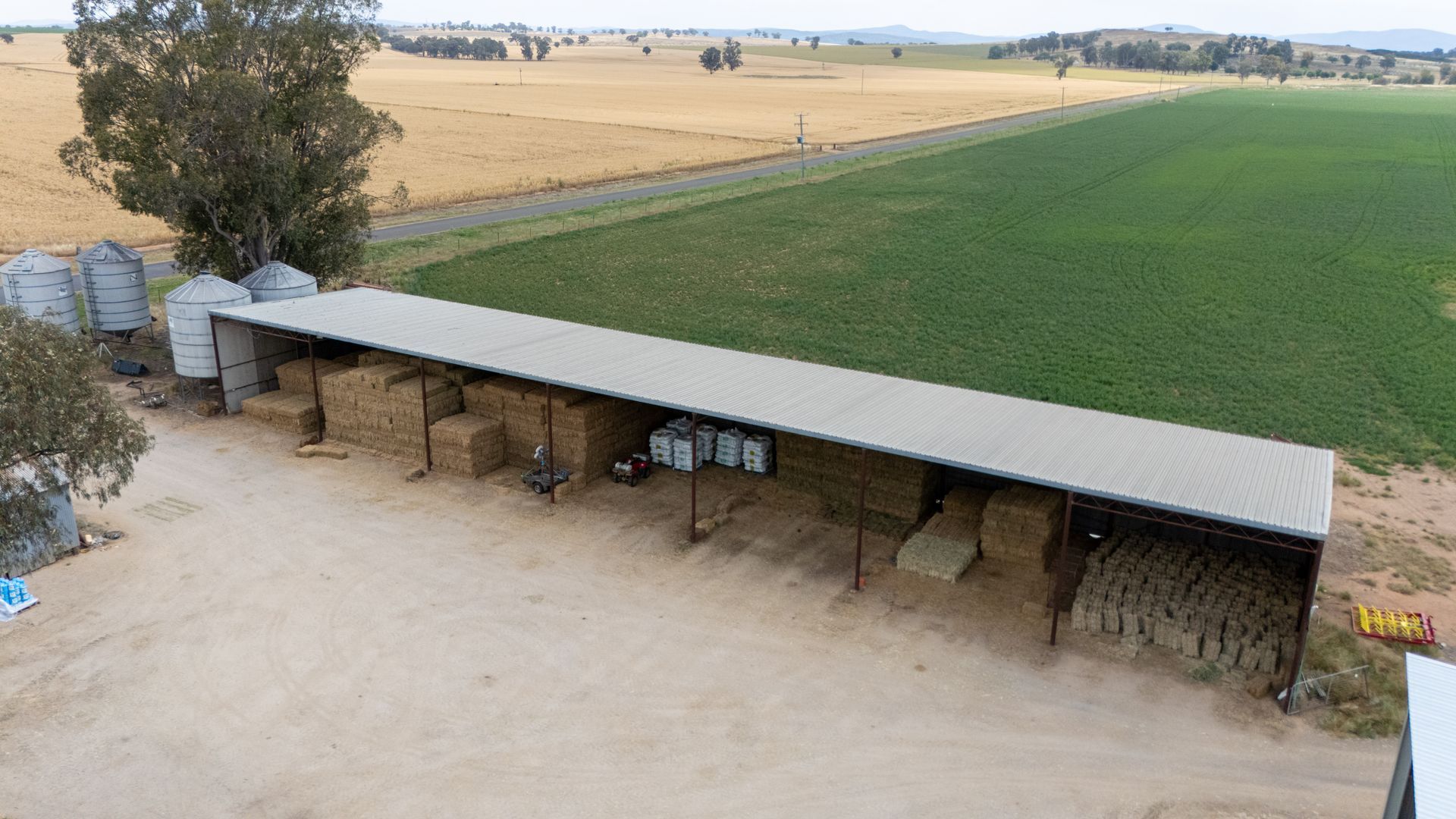 An aerial view of a farm with a lot of buildings