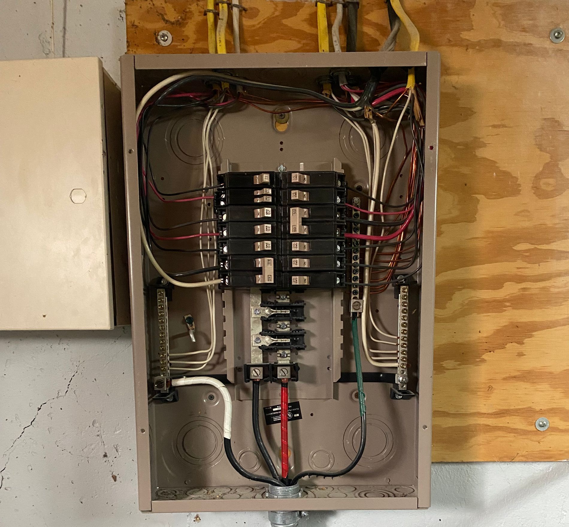 An electrical box with a lot of wires coming out of it