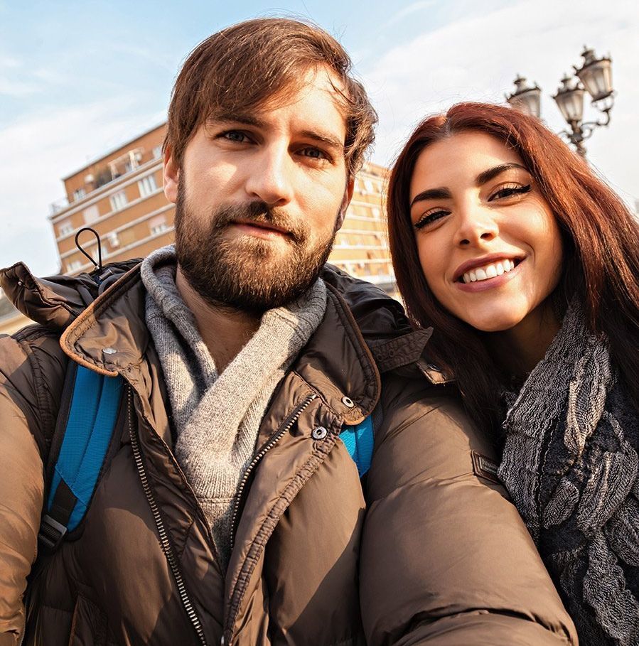 A man and a woman are posing for a picture together