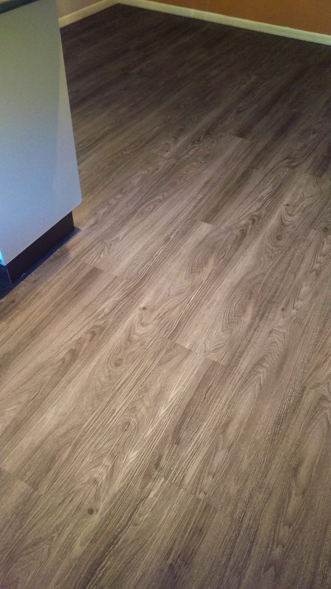 A close up of a wooden floor in a room