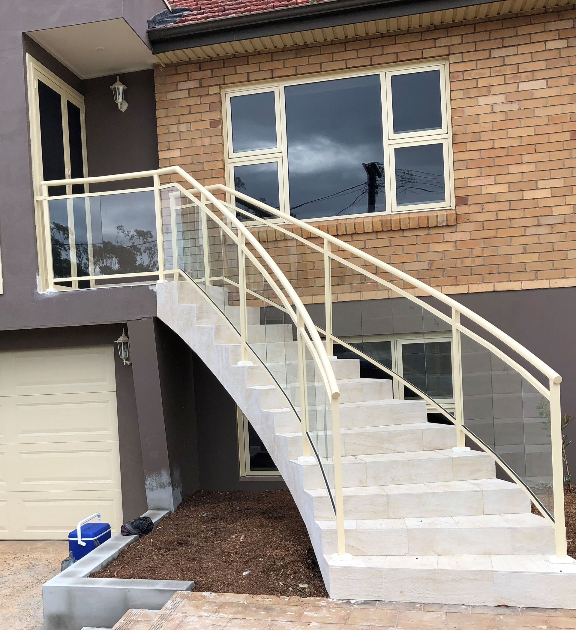 A set of stairs leading up to a brick house