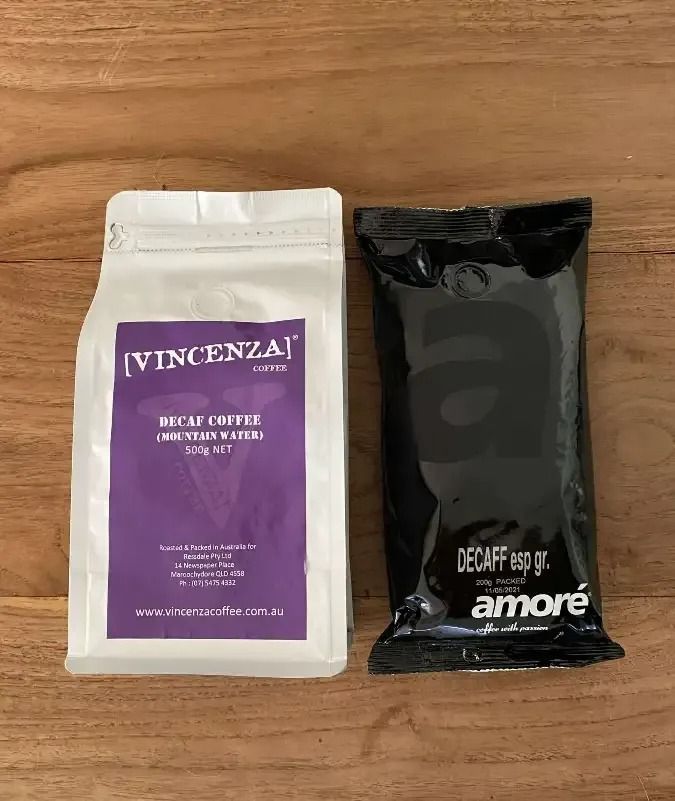 Two Bags of Coffee Are Sitting on a Wooden Table — Labroco Gourmet Coffee Supplier In Forster, NSW