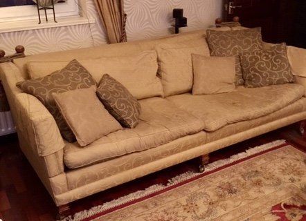 Before & After. Sofa re- upholstered & new cushion filings.