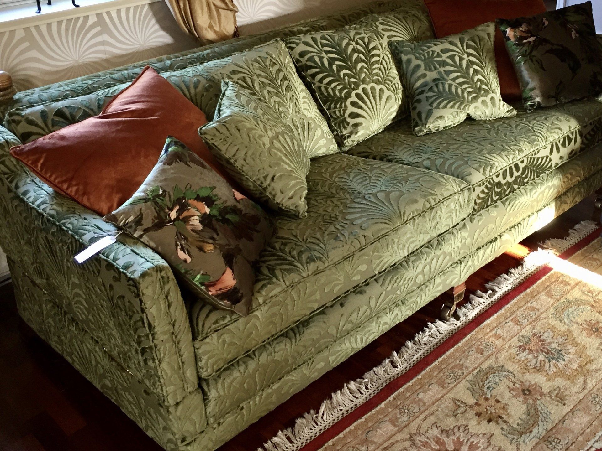 Re-upholstered sofa with new cushion interiors.
