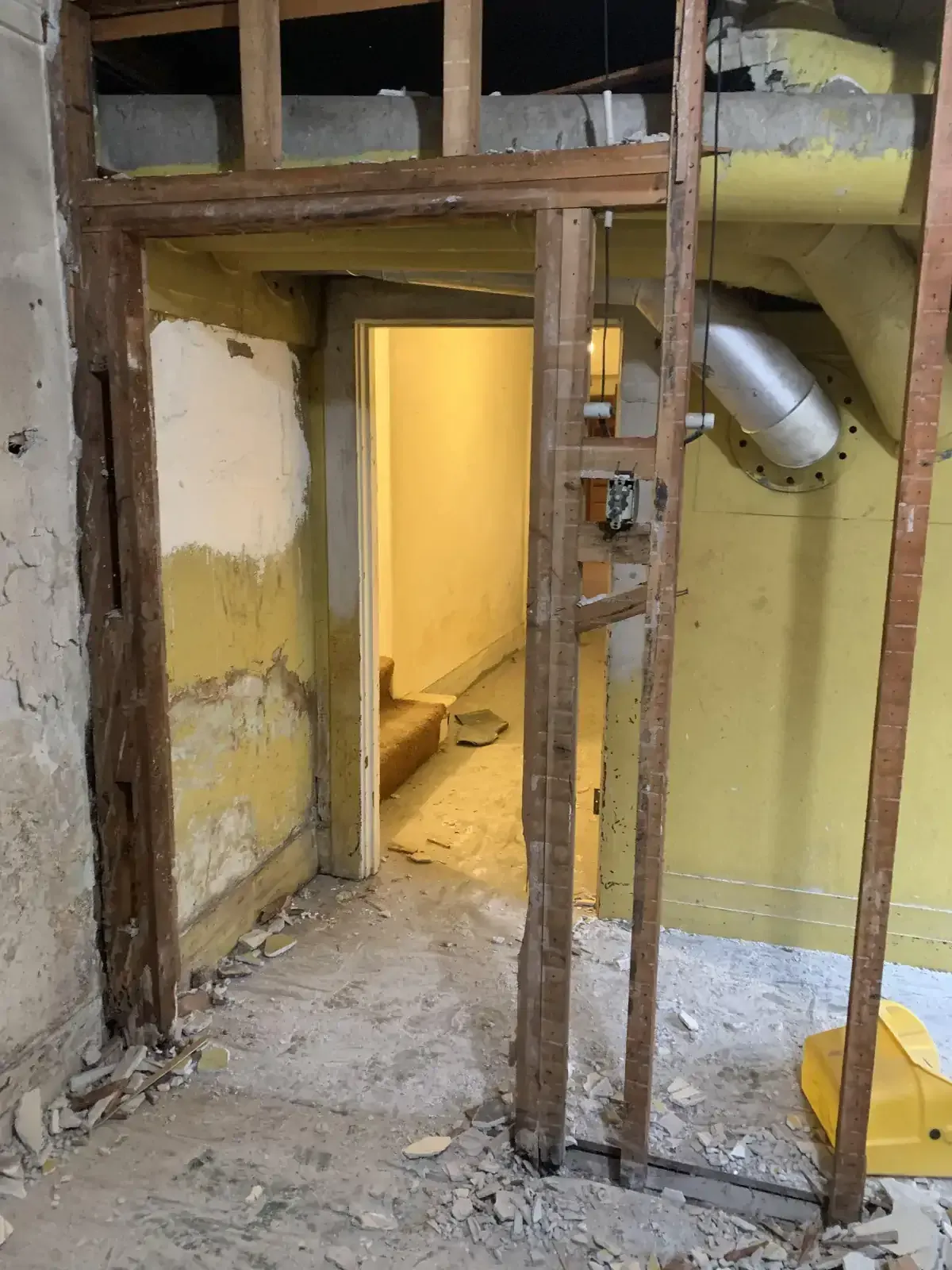 A doorway in a building that is being remodeled