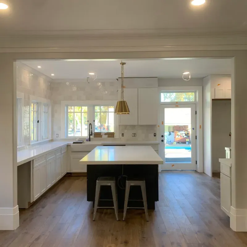 There is a large island in the middle of the kitchen.