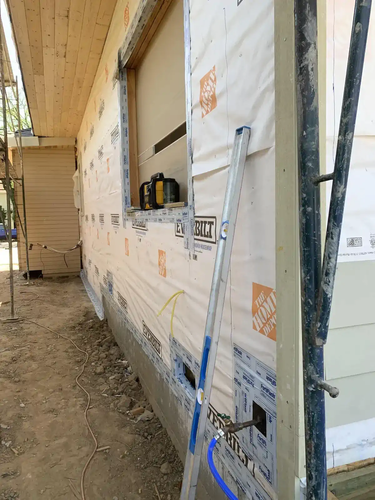 A house is being built with the home depot on the side of it