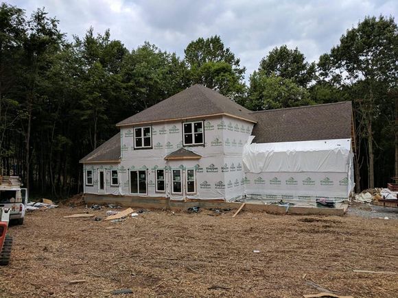 House Exterior with Two Garage Spaces and Concrete Floor Driveway — Ephrata, PA — Modular Home Erectors